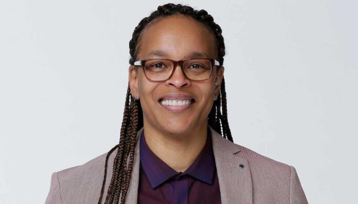 Teresa Weatherspoon wearing a blazer and smiling.