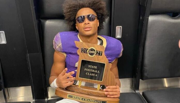 Jaycob Tatum holding his State Championship trophe