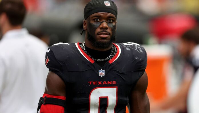 Azeez Al-Shaair wearing his Texans jersey