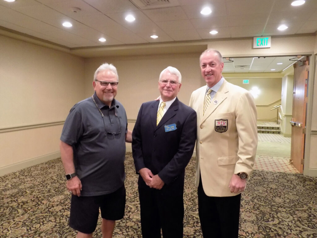 Coach Wiser, Coach Henry and Jim Kelly