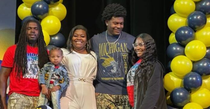 Ty Haywood with his mother and siblings